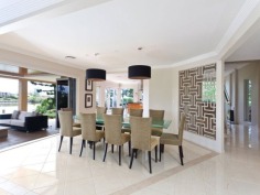This prestigious estate is situated at the end of the highly respected Maryland Avenue. Situated in privacy behind grand electric gates and sand stone walls are two prime acres on two titles.
The architect has designed this home to maximize its North facing position with views to the East as well. This park like setting with mature trees is elevated 1.7 meters above adjoining land and has not been affected by major floods. This recently refurbished residence offers 1,000 square meters of opulent decor with the latest sinks, tubs and tap ware. Separate from the main house and situated near the entry gates is 2 bedroom guest house with its own complete kitchen, laundry, lounge and study. A large pontoon and wharf beside the river gives access to the Broadwater and out to the ocean from your back yard.
Features of this property:
7 Bedrooms, 6 bathrooms, 5 car garage with parking for upto 10 vehicles
Master bedroom includes parents retreat, twin dressing room, riverside balcony, and deluxe ensuite
Designer chefs kitchen with granite bench tops, 2 oven plus warming ovens, and walk in pantry
A Helipad has been approved for this estate.
Championship tennis court with flood lights and pavilion with kitchen, bath and shower.
10 meter pontoon, jet ski cradle, power and water supply
Infar-red security cameras with back to base alarms
Automatic emergency power generator
fully automated irrigation
Future sub- division potential - subject to council approval
Formal living area with open fireplace
Wine cellar
indoor/outdoor entertaining
In-ground swimming pool
in home theatre with elevated seating and soundproof walls
Games room
sizable laundry
Ducted air-conditioning
Landscaped gardens with mature trees and lush lawns, Horses are permitted on the property
Sweeping 200 degree river and skyline views
Less than 5 minutes drive to Royal Pines Golf Resort, Emerald lakes golf, Lakelands golf
8 min drive to Major Shopping Centres, Schools and Central Business district
This property is currently on two titles with an option to purchase the main house and guest house on 1 acre, or purchase 1 acre of riverfront land for offers over $2 million
