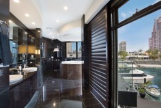 State-of-the-Art Architect designed masterpiece
Overview
Property Type
House
For Sale
$3,600,000
Garage
3
Carport
3
Web ID
2P1115
One of the most extraordinary homes located in an exclusive Gold Coast enclave is this waterfront property inspired by an Australian architect with over 80 squares of indoor/outdoor space showcasing views of the Surfers Paradise & Main Beach skyline , this home represents the best of modern architecture.
The attention to detail is apparent throughout this home with six bedrooms, six bathrooms and separate, New York style guest accommodation there is no denying this home is close to perfect. The expansive main level with its elegant sunken lounge leads onto a fabulous outdoor entertaining area or out by the plunge pool with BBQ area. This property offers numerous centres of activity for the entertainer and growing family alike.
The double storey ceilings give the property an air of immense height and space and with floor to ceiling glass panels allow unlimited views across to the city skyline and canals.
No expense has been spared in the finish of this residence featuring granite and marble floors with exclusive European lighting fixtures complemented by polished timber doors and feature walls.
The kitchen is a gourmet chef's delight with auto doors and Scandinavian appliances with black marble tops and many features too numerous to mention, There is also a concealed wine cellar for the avid wine buff.
Enjoy lazy days on your own private sandy beach or cool down with a dip in the plunge pool. For the boating enthusiast there is a jetty complete with boat shed and winch. The property comprises three lockup garages and an additional three secure car spaces to cater for visitors.
Beautifully landscaped gardens with imported water features and fishponds offer a perfect backdrop for this property which is nothing short of superlative.
Call for an inspection today to view this extraordinary masterpiece of design and style