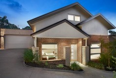 Glorious Modern Living
Boasting style and sun-drenched living enhanced by low-maintenance appeal, this well-appointed residence promises an easy lifestyle for young families or downsizers.
With polished timber floors and bathed in natural light, the open plan living-meals links to a contemporary kitchen with Caesarstone waterfall bench tops and stainless steel appliances, including a dishwasher.
There are two bedrooms on the entry level. One bedroom features a walk-in-robe that connects to the luxurious bathroom with corner spa, shower, toilet and vanity with stone bench top. A second bedroom also offers built-in-robes. The bright and airy main suite is upstairs and affords large built-in-robes with modern en-suite.
Further appointments include generous study nook, modern laundry, double garage with remote door and internal access, garden shed, water tank (for gardens), evaporative cooling, ducted heating, alarm, under-stairs storage, ceiling fans and stairwell lighting.
Glass sliding doors in the meals-living zone open to the timber deck delivering effortless everyday living as well as entertaining in the landscaped gardens.
The property is within walking distance to Bolton Street shops, Eltham High School, Montmorency South Primary, buses and parks.
Barry Plant Real Estate Eltham
Property Type: Townhouse
Property ID: 2628682
Melway Reference: 21 F5
Virtual Floorplan Link: Interactive Floorplan
Advanced Features: Alarm System
Built In Robes
Deck
Dishwasher
Ducted Heating
Ensuite
Evaporative Cooling
Floorboards
Indoor Spa
Outdoor Entertaining
Remote Garage
Shed
Water Tank