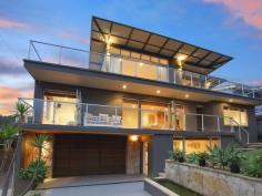 3 Attunga Road, Newport NSW An Incredibly Stylish Architectural Triumph By The Beach Crafted to showcase award-winning contemporary design and maximise northern eastern sunshine, this family oasis has been finished to the highest possible standard. The residence is nestled on a level 559sqm block amid beautiful low maintenance gardens and is placed within minutes stroll to Newport Beach. An unrivaled haven for those who love to entertain, the home provides complete in/outdoor integration with an expansive deck and sparkling solar heated pool. Free flowing interiors offer soaring ceilings, blackbutt flooring, feature lights, and stunning use of timber and glass. * Open plan living and spaces flow outside through large bi-folds with beautiful views of Newport beach * State-of-the-art kitchen equipped with Caeserstone island bench * Master is privately separated from the other bedrooms * Double garage, location is within easy walking distance to shops, parks and schools * An idyllic summer retreat with an impeccable attention to detail displayed throughout * Pick up your surfboard and amble to the ocean in moments * Large entertaining decks * Perfect weekend retreat * Low land tax Property Snapshot Property Type: House Construction: Brick