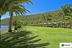 2868 River Road, Wisemans Ferry NSW For Sale - Villas From $485,000 bed 2 bath 1 car 2 Ko-veda Holiday Park Estate Ltd. is the only brand new facility of its kind in Australia, based on the American idea "Gated Facility", assuring excellent security and luxurious surroundings for its occupants. It`s an upmarket absolute waterfront resort catering only for the individual Villa owners and their families and friends. No public access whatsoever. The Park is situated in very pristine settings on the banks of the Hawkesbury River within 1 hour pleasant drive from Sydney CBD on non-congested roads, even in peak holiday periods, and when you get there, you get the feeling you`re completely separated from the rest of the world, very protected from all the elements situated between mountain sides on both sides of the 500 metre wide River, with Pitt Water & Windsor 1 hour away in opposite directions by boat. The Park consists of 42 immaculately kept acres, 1000m water frontage with established Jetties & Pontoons. Every Villa owner has absolute water frontage within 20m to the waters edge, exclusive private beach and boat mooring directly in front. The Park is also an attractive destination for Cruiser owners. We offer year round all inclusive cruiser mooring or dry storage on land, we will actually custom build an on-site trailer for your boat up to 40` in length, a very attractive alternative for the discerning Cruiser owner to store this valuable asset on land for at least half the year may be more and only launch it for peak periods, allowing for hull maintenance, etc.. Experienced mechanics, boat builders, trimmers, etc.is also available at any given time. New Villa owners can choose their own desired interior layout, colour schemes, choice of appliances, tiles, etc.. The Villas have a double garage attached to them for the storing of Powerboats, jet skis and every conceivable gadget used for water activities of any kind. For more information visit website www.koveda.com.au or contact Travis Reeve on 0414 347 713