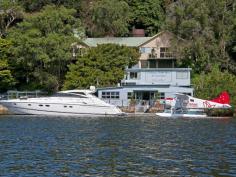 2 Anderson Place, Cottage Point NSW ottage Point Inn Restaurant & Apartments - Freehold For Sale Set in a location without comparison, is this famous waterfront restaurant/landmark - an institution amongst knowledgeable diners across Sydney and the world for over 30 years. This is an exceptional opportunity for an investor or entrepreneur to purchase one of the Hawkesbury's most exciting waterfront estates in a key location only 50 minutes from the CBD. The Cottage Point Inn Restaurant, set on the water at the junction of Cowan Waters and Coal & Candle Creek, was originally the Cottage Point boatshed and general store. The building was converted to a restaurant in the 1970s and has been operating since. Set directly behind the restaurant are two separate, fully self-contained apartments or cottages, which are included in the restaurant lease. Features include: - 5+5 year lease signed in 2012 by the tenant for restaurant and apartments - Income of $308,885.42 per annum (inclusive of GST) - Rent is indexed at CPI annually - Tenant pays 100% of outgoings (as defined in the lease agreement) - Tenant has over 30 years history of ownership and management of the restaurant and apartments - Improvements on the title include the Cottage Point Inn Restaurant building with substantial waterfront terraces, commercial kitchen, inside dining, air conditioning & his and her's bathroom - Substantial and wide waterfrontage - Floating deepwater pontoon for seaplanes and large boats - Office or flat above the restaurant with two rooms and bathroom - Two apartments set behind the restaurant - Both apartments have wide 180 degree views of magnificent Cowan Waters and Ku-ring-gai Chase National Park - Cottage one "Cowan Waters Apartment" is a self-contained apartment with full kitchen facilities, large dining and lounge area, private balcony, separate double bedroom, spa bath and reverse cycle air-conditioning - Cottage two "Riverview Suite" is equipped with breakfast bar, private balcony, lounge area, well-appointed bathroom & reverse cycle air-conditioning - License agreement (sub leased to the restaurant tenant) with National Parks and Wildlife services for the use of the land that sits over the high water mark - Access to the restaurant is by road, boat, ferry or seaplane Property Snapshot Property Type: House