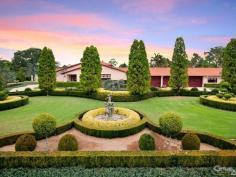 Dural NSWStory Of A Fairy Tale A beautiful blend of timeless charm and modern styling is this magnificent double bricked home set on 1.43 (approx.) desirable landscaped hectares. Every direction you turn there is something amazing to see from water features to amazing gardens to the detail of the architectural design of the home. Upon entering the driveway through the wrought iron electric gates you will immediately feel as though you have stepped into a fairy tale! You will love the impressive grand entrance with marble floors, huge crystal chandeliers and sublimely crafted centre piece. The style and features of this property cannot be expressed purely in words. However, here is a taste of what this magnificent estate comprises of: * Elegant formal lounge room with fireplace expanding to the sunken formal dining room * Gourmet timber kitchen equipped with Miele appliances, granite bench-tops, dishwasher, 3 ovens, microwave and an island bench with a selection of cooking elements * Huge walk-in pantry leading to the cool room * Meals area off kitchen * Family room with fireplace * Casino dubbed room off family room * Ballroom with bar, stage, commercial grade kitchen fit for a chef plus a billiard room - Perfect to host your own Great Gatsby party! * Additional lounge room with pitched wooden panel ceiling, sink and French doors opening to the yard * Master bedroom with walk-in robe, ensuite and it's own courtyard * Ensuite to the other 4 bedrooms in the main house * Resort style bathroom with spa, dual sink, shower and toilet room * Guest wash closets * Cancel your gym membership as it includes a gymnasium room and sauna * Extra living room with laundry tub to the right wing * The guest house features a lounge & dining room, kitchen with dishwasher, 2 bedrooms and bathroom with separate toilet * 2 entertainment areas overlooking the pool and BBQ area * Alluring salt water inground pool with spa, waterfall and it's own island surrounded by palm trees and plants * Hold your own grand slam with this full size tennis court * Lots of grass area - perfect for playing croquet or equestrian * 22x12m shed/mechanic workshop with stable * 6-car automatic garage Additional features include: imported Italian wallpaper, ducted air conditioning throughout, alarm system, intercom, security camera system, detailed cornices, high ceilings, feature skylights, French doors & windows, huge laundry, study room, 35,000L underground water tank, septic tank, timers to the external lights and fountains. Turn your dream into a reality! For a full list of inclusions and to arrange a private inspection, call Ruma Mundi today on 0411 030 202 or 02 8883 1088.
