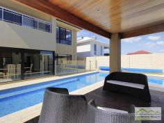 6 Lautoka Rise, Mindarie WA Beaumonde homes have been built on reputation since 1986 and this stunning 2008 built home is a classic example of the style, quality of craftsmanship and attention to detail that Beaumonde demand. The owners of this gorgeous home insisted on important facets of the build to ensure their home exuded sophistication and quality like 38 and 37 course ceilings, imported Italian porcelain tiles, pewter granite, Eastern Blackbutt flooring from Grandwood floors and Daiken Reverse Cycle Ducted Air conditioning. Not only is this home a stunning/quality built property but it is located in a very desirable position only minutes walk to the Mindarie Marina, Claytons beach the schools and shops. Gorgeous ocean views greet you as soon as you walk upstairs with the bright blue sparkle of the pool below. This home is faultless, see the list of features below: Level One: Inviting generous decked porch area with double door entry Classic beautiful lobby bringing you into the formal lounge Formal Lounge the perfect place to great your guests Double Doors lead to the open Family/Dining/Kitchen-the most important and most used area of the home with recess area to family room for the TV, a bank of glass surrounding the dining area. Huge kitchen with Pewter granite bench tops that have shark nosed edging, massive walk in pantry, central island work area giving you uninterrupted views of the swimming pool, quality under bench oven and gas hot plate with overhead stainless steel and glass range hood. Appliance cupboard and good sized fridge recess plus plenty of preparation area Leading from the hub of the home you enter the purpose built Theatre Room with dual access to the outdoors so can be a multi-purpose room great as a big play room when the children are small Three very generous children?s bedrooms all with double robes and of course those 38 course ceilings Main Bathroom has a separate WC with powder room which then leads to the main shower and the oval bath Walk in Linen giving plenty of storage Well equipped laundry Level Two: Beautiful elegant staircase leading to the top level Huge open space consisting of the Study and the upstairs Lounge Kitchenette/Bar upstairs with glass splashback, fridge, microwave and sink Massive balcony with beautiful ocean views Main Bedroom Suite with private balcony thru double doors Massive walk in robe Amazing En suite with double basin vanity, huge oval spa bath, generous shower and separate WC Extras you will enjoy: Outdoor Cabana with decking and timber lined ceiling that overlooks the pool Stand Alone bricked Shed ? ideal to convert into shower block Ducted Reverse Cycle Air conditioning Solid timber flooring and Italian porcelain tiling Warm timber double front doors Storage under the Stairs Huge double garage with sectional remote door Quality light fittings and down lights Wrap around below ground swimming pool with water feature Extensive limestone paving surrounding the home Grassed area for the kids to play Side access thru timber gates Completed in 2008 Approximate size of home in total 380sqm Block size 612sqm