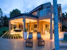 This prestigious estate is situated at the end of the highly respected Maryland Avenue. Situated in privacy behind grand electric gates and sand stone walls are two prime acres on two titles.
The architect has designed this home to maximize its North facing position with views to the East as well. This park like setting with mature trees is elevated 1.7 meters above adjoining land and has not been affected by major floods. This recently refurbished residence offers 1,000 square meters of opulent decor with the latest sinks, tubs and tap ware. Separate from the main house and situated near the entry gates is 2 bedroom guest house with its own complete kitchen, laundry, lounge and study. A large pontoon and wharf beside the river gives access to the Broadwater and out to the ocean from your back yard.
Features of this property:
7 Bedrooms, 6 bathrooms, 5 car garage with parking for upto 10 vehicles
Master bedroom includes parents retreat, twin dressing room, riverside balcony, and deluxe ensuite
Designer chefs kitchen with granite bench tops, 2 oven plus warming ovens, and walk in pantry
A Helipad has been approved for this estate.
Championship tennis court with flood lights and pavilion with kitchen, bath and shower.
10 meter pontoon, jet ski cradle, power and water supply
Infar-red security cameras with back to base alarms
Automatic emergency power generator
fully automated irrigation
Future sub- division potential - subject to council approval
Formal living area with open fireplace
Wine cellar
indoor/outdoor entertaining
In-ground swimming pool
in home theatre with elevated seating and soundproof walls
Games room
sizable laundry
Ducted air-conditioning
Landscaped gardens with mature trees and lush lawns, Horses are permitted on the property
Sweeping 200 degree river and skyline views
Less than 5 minutes drive to Royal Pines Golf Resort, Emerald lakes golf, Lakelands golf
8 min drive to Major Shopping Centres, Schools and Central Business district
This property is currently on two titles with an option to purchase the main house and guest house on 1 acre, or purchase 1 acre of riverfront land for offers over $2 million