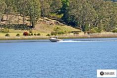 2868 River Road, Wisemans Ferry NSW For Sale - Villas From $485,000 bed 2 bath 1 car 2 Ko-veda Holiday Park Estate Ltd. is the only brand new facility of its kind in Australia, based on the American idea "Gated Facility", assuring excellent security and luxurious surroundings for its occupants. It`s an upmarket absolute waterfront resort catering only for the individual Villa owners and their families and friends. No public access whatsoever. The Park is situated in very pristine settings on the banks of the Hawkesbury River within 1 hour pleasant drive from Sydney CBD on non-congested roads, even in peak holiday periods, and when you get there, you get the feeling you`re completely separated from the rest of the world, very protected from all the elements situated between mountain sides on both sides of the 500 metre wide River, with Pitt Water & Windsor 1 hour away in opposite directions by boat. The Park consists of 42 immaculately kept acres, 1000m water frontage with established Jetties & Pontoons. Every Villa owner has absolute water frontage within 20m to the waters edge, exclusive private beach and boat mooring directly in front. The Park is also an attractive destination for Cruiser owners. We offer year round all inclusive cruiser mooring or dry storage on land, we will actually custom build an on-site trailer for your boat up to 40` in length, a very attractive alternative for the discerning Cruiser owner to store this valuable asset on land for at least half the year may be more and only launch it for peak periods, allowing for hull maintenance, etc.. Experienced mechanics, boat builders, trimmers, etc.is also available at any given time. New Villa owners can choose their own desired interior layout, colour schemes, choice of appliances, tiles, etc.. The Villas have a double garage attached to them for the storing of Powerboats, jet skis and every conceivable gadget used for water activities of any kind. For more information visit website www.koveda.com.au or contact Travis Reeve on 0414 347 713