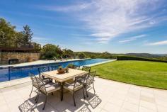 54 Lane Cove Road, Ingleside NSW For Sale - Offers Over $8,500,000 8 9 6 Unequivocally one of Sydney's finest estates, this magnificent 5 acre holding has left nothing undone its quest for luxurious liveability. From its spectacular gala indoor/outdoor entertaining venues including a tennis court, 26 metre heated pool, indoor jumps arena and state-of-the-art stables, it exceeds the expectations of the most discerning elitist on every front. Nestled on private rolling lawns with sweeping 180 degree north easterly ocean and coastal vistas, it is only 30 minutes from the CBD and moments to village shops, schools and beaches. Drive through the secure gated entry and wind your way past the timber post, rail paddocks and cascading waterfall to the residence. From the moment you lay eyes on the exquisitely crafted facade it becomes immediately apparent that this residence is of the highest calibre. Exquisitely crafted from sandstone and wrapped in a timber posted bull-nose verandah with a large turret romancing the facade, it tastefully fuses Australian colonial and European provincial themes with designer finishes to create a retreat of elegance and sophistication with a warm country-style ambiance. Guests are welcomed through the grand formal entrance foyer with soaring double height ceilings with an elaborate antique chandelier lighting the way. The living spaces have been cleverly interwoven to integrate with an enormous indoor/outdoor loggia with an open fireplace. Separate living and dining areas merges seamlessly with level lawns and soaks in the north easterly sun, summer breezes and sweeping views. It comes complete with formal living and dining spaces plus an enormous family room or home cinema with surround sound and mounted flat screen TV. Finished in imported Italian marble with a breakfast bar and state-of-the-art European appliances, the kitchen is equipped with a commercial-grade gas stove with barbecue plate and two ovens, two integrated dishwashers and pantry. King sized bedrooms all with built-ins and ensuites. The palatial master forms the heart of circular turret & features towering ceilings, dressing room, wardrobes built into the circular wall & a spiral staircase that leads to a circular mezzanine library with access to the sun drenched terrace with spectacular views. Absolute heaven for the dedicated wine connoisseur, the wine cellar is locked behind iron gates and consists of a labyrinth of sandstone walled rooms with cedar wine racks holding up to 4,000 bottles.