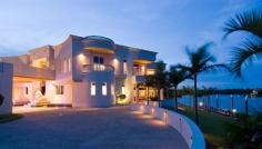 "Sails" is the epitome of luxury, light and space. Set on a waterfront estate of 5,371m2 in the secure Hope Island Resort, this mega-mansion provides flawless standards of luxury. The home boasts vast living spaces, and offers the ultimate in comfort and splendour, with every detail meticulously taken care of.
The four-level residence is the ultimate in visual appeal, displaying architectural brilliance at it's best. Soaring ceilings and incredible water views take your breath away at every turn. Yet with all of it's stunning and lavish features, this is a residence that provides practical living and splendid seclusion.
- 5,371m2 grounds with 176 metres of water frontage
- 2709m2 approx living space
- Deep water mooring
- Six separate living areas
- Magnificent dedicated dining room
- Superb commercial-grade kitchen
- Two grand master suites
- Five double bedrooms, all ensuited
- Fully-self-contained penthouse on top level
- Ten seat fully-equipped tiered theatre
- Office suite with boardroom
- Swarovski crystal chandeliers throughout
- Outdoor entertaining areas including sweeping terraces and custom-built Bali hut
No FIRB approval is required for overseas buyers.
Only an inspection can truly reveal what this palatial home has to offer. View the online video to get a glimpse into this wondrous abode (click on online or virtual tour to view).