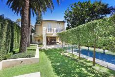 Magnificent European-inspired residence 81 Balfour Road , BELLEVUE HILL Auction Reminiscent of a classically inspired European estate, this impressive residence showcases grand proportions, meticulously selected finishes and a seamless transition between the indoors and the breathtaking alfresco areas. Completed in 2007, it's set on a level 802 sqm parcel of land in one of the East's premier blue ribbon enclaves, just a brief walk to the Rose Bay waterfront. The two-storey home contains five bedrooms and 4.5 bathrooms, including a lavish master suite with a travertine ensuite, custom-designed dressing room and a Juliet balcony. Both the elegant formal lounge and dining room and stately office are warmed by gas fires. Encompassing a sleek CaesarStone Miele kitchen, the casual entertaining space opens to an expansive terrace complete with an in-built barbeque and automated awnings. It overlooks impeccably manicured gardens with sculpted hedges, towering palm trees, a gas-heated heated pool, putting green and a poolside cabana/gym with a WC and fridges.
