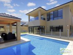 6 Lautoka Rise, Mindarie WA Beaumonde homes have been built on reputation since 1986 and this stunning 2008 built home is a classic example of the style, quality of craftsmanship and attention to detail that Beaumonde demand. The owners of this gorgeous home insisted on important facets of the build to ensure their home exuded sophistication and quality like 38 and 37 course ceilings, imported Italian porcelain tiles, pewter granite, Eastern Blackbutt flooring from Grandwood floors and Daiken Reverse Cycle Ducted Air conditioning. Not only is this home a stunning/quality built property but it is located in a very desirable position only minutes walk to the Mindarie Marina, Claytons beach the schools and shops. Gorgeous ocean views greet you as soon as you walk upstairs with the bright blue sparkle of the pool below. This home is faultless, see the list of features below: Level One: Inviting generous decked porch area with double door entry Classic beautiful lobby bringing you into the formal lounge Formal Lounge the perfect place to great your guests Double Doors lead to the open Family/Dining/Kitchen-the most important and most used area of the home with recess area to family room for the TV, a bank of glass surrounding the dining area. Huge kitchen with Pewter granite bench tops that have shark nosed edging, massive walk in pantry, central island work area giving you uninterrupted views of the swimming pool, quality under bench oven and gas hot plate with overhead stainless steel and glass range hood. Appliance cupboard and good sized fridge recess plus plenty of preparation area Leading from the hub of the home you enter the purpose built Theatre Room with dual access to the outdoors so can be a multi-purpose room great as a big play room when the children are small Three very generous children?s bedrooms all with double robes and of course those 38 course ceilings Main Bathroom has a separate WC with powder room which then leads to the main shower and the oval bath Walk in Linen giving plenty of storage Well equipped laundry Level Two: Beautiful elegant staircase leading to the top level Huge open space consisting of the Study and the upstairs Lounge Kitchenette/Bar upstairs with glass splashback, fridge, microwave and sink Massive balcony with beautiful ocean views Main Bedroom Suite with private balcony thru double doors Massive walk in robe Amazing En suite with double basin vanity, huge oval spa bath, generous shower and separate WC Extras you will enjoy: Outdoor Cabana with decking and timber lined ceiling that overlooks the pool Stand Alone bricked Shed ? ideal to convert into shower block Ducted Reverse Cycle Air conditioning Solid timber flooring and Italian porcelain tiling Warm timber double front doors Storage under the Stairs Huge double garage with sectional remote door Quality light fittings and down lights Wrap around below ground swimming pool with water feature Extensive limestone paving surrounding the home Grassed area for the kids to play Side access thru timber gates Completed in 2008 Approximate size of home in total 380sqm Block size 612sqm