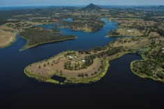 Bimbadeen means place of waterbirds - a waterfront acres sanctuary with 300 degree lake views, fishing, boating, sailing, flying??? Frontage to beautiful Lake Macdonald overlooking Noosa's botanical gardens. Private driveway is boarded by water on either side, with exotic wildlife and magnificent views to Mt Cooroy & Tinbeerwah. The perfect combination of being only 5 minutes from Cooroy and 15 minutes to Noosa, with town water, sewer and peace and tranquility. Sprawling brick residence with raked ceilings, french oak floors, gourmet kitchen, gas & induction cooking and ducted air conditioning. Solid timber doors & windows throughout. 3 separate living areas, wide entertaining patios, 4 car garage and boat store/cellar under the home.
500m Bitumen airstrip, fully insulated 2 plane hangar with workshop, separate machinery shed and van port.
Stroll the park like acreage on this resort style sanctuary tailored for relaxation. Host a tennis party on your own flood lit tennis court. This property is your opportunity to live the dream, own or operate an aircraft, also ideal for car or boat enthusiast with 2 large quality sheds and 3 phase power.18.29 acres/7.4 hectares. For further details or inspection please contact our office. rh06506
Bimbadeen - 18.29 acressealed airstrip2km Lake Frontplane hangar and shedstotally private