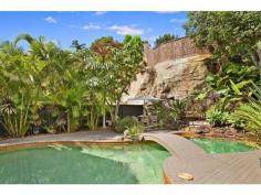 24 Wyong Road, Mosman NSW Surrounded by stunning landscaped gardens, this three/four bedroom family home offers a choice of spacious living areas and a lush oasis-like pool, set in a tropical designed garden. Located in an exclusive enclave, it's minutes to the CBD, Mosman and Cremorne villages, Balmoral Beach and the Middle Harbour foreshore. Features include: Immense street appeal with deep manicured front gardens Sunlit bay fronted formal living and dining with open fireplace Casual dining with bi-folds to a covered terrace and the pool European appointed CaesarStone kitchen, large laundry Lofty sitting area with entertainer's bar, upstairs study/library Casual living opens to a deep north facing travertine terrace Versatile floorplan, built-ins, 2.5 baths incl luxurious family bath DLUG, large sandstone cellar, ducted heating, air conditioning Upstairs study or optional fourth bedroom