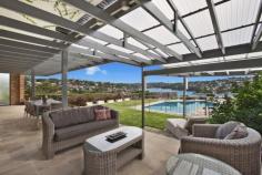32 Bay Street, Mosman NSW This luxuriously renovated family home boasts panoramic views across Quakers Hat Bay and Middle Harbour and offers a private whisper quiet lifestyle. This property is a rare combination of a family friendly layout, superb entertaining possibilities and world class views. Features include: Stylish renovated interiors, large 915 m2 block, landscaped front & rear gardens Vast living areas flowing to covered entertaining with stunning back drop Child friendly garden/lawn and swimming pool all visible from kitchen & living Gourmet integrated Caesar stone kitchen with 2 bosch ovens Superb master suite with luxurious ensuite, walk in robes, stunning views Hardwood and Travertine floors, stained glass, LED downlights, Ducted air-conditioning Double automatic garage with internal access, additional storage, alarm Moments to shops, schools, buses and scenic bayside reserves A fabulous home for families of all ages with a spectacular middle harbour backdrop. A must see.
