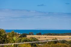 2 Eastview Terrace, Jan Juc VIC Enjoy the Eastview Lifestyle! If you are seeking out a home in Jan Juc it stands to reason that you are drawn to the water, what better way to fulfill that need than with a view of the ocean to wake up to every morning. Situated in one of the quieter pockets of a relaxed coastal village, this property in Eastview Terrace takes full advantage of its position which is in easy walking distance to the beach, golf club and shops ensuring you enjoy the landscape and local lifestyle. Contemporary in design, the double story home makes the most of an easy care block of land by maximising both living and outdoor space. Inside, four generous bedrooms on the ground floor are serviced by both a modern family bathroom and ensuite to the master with all except the fourth bedroom enjoying the benefit of WIRs. Providing direct access to the gardens (complete with large garage, double carport and secure parking for boat/caravan), a large second living area on this level provides flexibility and a perfect retreat for the younger members of the family. The upper level is dedicated to everyday living with a bright, spacious kitchen flowing through the dining and family rooms (beyond the handy powder room) onto a well_positioned balcony that offers sweeping, panoramic views over the ocean. Clever design elements, such as the north facing highlight windows, flood the room with natural light giving further depth to the richness of polished timber floorboards whilst, the morning sun through the expanse of windows opening to the balcony invite lazy breakfasts with a paper and the reminder that you do indeed, live by the beach. The simplicity of good quality, well maintained fixtures and neutral tones makes this a comfortable, functional and laid_back home to live in. It is a welcoming home that offers families an opportunity to live their coastal dream without fuss but with a real emphasis on capturing the desire and making it real!