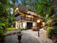 ONE-OF-A-KIND DREAM HOME, EXCLUSIVE SETTING 7 PERRINS CREEK ROAD, OLINDA, VIC 3788 4 2 6 Entertainers paradise Exclusive privacy and tranquillity Lush low-maintenance forest setting Set on approximately 1 acre of low-maintenance garden surrounds with another 9 acres of lush private forest offering pure peace and serenity, this much-loved property with widespread parquetry flooring and cable internet offers flexible living over 3 distinct levels. With its gorgeous Tudor architectural style modelled on the best of Western Europe; Feathertop, a hidden gem of a property nestled amongst giant poplars and lush ferns is the ultimate seclusion weekender, fairytale family home or even possible one-of-a-kind B&B while being only 15 minutes away from the Monash Freeway. On the entry level find an expansive living room (with bay window), separate dining and extensive kitchen (boasting Blanco appliances); powder room and private study with built-in mahogany wall units. Decorative Oregon ceiling beams extend throughout. An amazing spiral wooden staircase ascends to a vast master bedroom with ensuite (double shower). 2 further bedrooms and a huge main bathroom with spa bath and double basins can be found under the characteristically steeply pitched roof. All bedrooms include high quality crafted built-in robes and chests of draws and their own private balconies. Additional storage area in the attic completes the 1st floor. The open plan basement provides the perfect opportunity to escape the summer holiday heat. Set up your own theatre or games room, gym and wine cellar. Also discover on this floor a separate laundry, additional powder room and internal access to a 6 car concrete built garage. Perfect for entertaining, your guests who will love to visit this picturesque setting - entertain amongst the treetops in the paved outdoor areas or on the extensive balcony surrounding the first level. If you have ever wanted a fairy tale life or home to be captivated by, Feathertop will make your dreams come true! FOR SALEExpressions Of Interest FEATURES GENERAL FEATURES Property Type: House Bedrooms: 4 Bathrooms: 2 INDOOR Indoor Spa Built in Wardrobes Dishwasher Air Conditioning OUTDOOR Garage Spaces: 6 OTHER FEATURES Privacy and Tranquillity, Entertaining terraces, Tudor architecture , Parquetry flooring CONTACTS SCOTT BANKS Mobile: 0411 700 099 Email this agent
