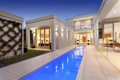 30 Balmoral Avenue, Strathmore VIC For Families Today, Nothing Could Be Finer Designed and built to provide a refined response to today's family needs, this enviably situated residence achieves a brilliant balance of luxury and light, space and sophistication. Elegant and impressive from first glance to final detail, this landmark home's alluring formal lounge or theatre room features a 2.5m drop down screen and leads to superb separate living/dining areas framed by a granite kitchen with smeg appliances and walk in pantry and a fabulous alfresco entertaining pavilion with its own BBQ kitchen. A stunning 14m lap pool, with a pool-side bathroom, enhances the outdoor appeal. Two downstairs bedrooms, each with its own bathroom, and two upstairs bedrooms introduced by a landing with unforgettable city views, are complemented by a spacious family bathroom and a sunny balcony. Hydronic slab heating and refrigerated air-conditioning, C-BUS home automation, Foxtel wiring and huge double garage only commence a comprehensive luxury list. INSPECT BY APPOINTMENT