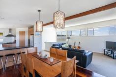 2 Eastview Terrace, Jan Juc VIC Enjoy the Eastview Lifestyle! If you are seeking out a home in Jan Juc it stands to reason that you are drawn to the water, what better way to fulfill that need than with a view of the ocean to wake up to every morning. Situated in one of the quieter pockets of a relaxed coastal village, this property in Eastview Terrace takes full advantage of its position which is in easy walking distance to the beach, golf club and shops ensuring you enjoy the landscape and local lifestyle. Contemporary in design, the double story home makes the most of an easy care block of land by maximising both living and outdoor space. Inside, four generous bedrooms on the ground floor are serviced by both a modern family bathroom and ensuite to the master with all except the fourth bedroom enjoying the benefit of WIRs. Providing direct access to the gardens (complete with large garage, double carport and secure parking for boat/caravan), a large second living area on this level provides flexibility and a perfect retreat for the younger members of the family. The upper level is dedicated to everyday living with a bright, spacious kitchen flowing through the dining and family rooms (beyond the handy powder room) onto a well_positioned balcony that offers sweeping, panoramic views over the ocean. Clever design elements, such as the north facing highlight windows, flood the room with natural light giving further depth to the richness of polished timber floorboards whilst, the morning sun through the expanse of windows opening to the balcony invite lazy breakfasts with a paper and the reminder that you do indeed, live by the beach. The simplicity of good quality, well maintained fixtures and neutral tones makes this a comfortable, functional and laid_back home to live in. It is a welcoming home that offers families an opportunity to live their coastal dream without fuss but with a real emphasis on capturing the desire and making it real!