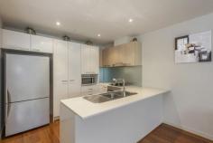 2/881 Doncaster Road, Doncaster East VIC Impeccable & Inviting Presenting the height of style and sophistication, this stunning ground floor apartment sits nestled in a boutique residential complex opposite Jackson Court. Showcasing high quality structure, fixtures and design, and a sleek contemporary aesthetic, it presents a spectacular open floor plan that combines the kitchen, living and dining domain with a private balcony plus 2 bedrooms serviced by 2 bathrooms. Also features: *Polished floorboards; SS appliances *Central bathroom & ensuite; Laundry facilities *Split system heating & air conditioning *Secure basement car park & storage space *Close to buses, schools, parks & sports facilities *Near to Doncaster Park+Ride, Westfield & Eastern Freeway