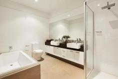 4/ 3 Sturt ESSENDON Bed 3 | Bath 3 | Car 2 Inspection Times Auction Times 12:00pm - 12:30pm Saturday, 17 May 2014 11:00am Saturday, 14 Jun 2014 Alluring Lifestyle In Desirable Locale Revel in the exemplary living style presented by this modern three bedroom residence on 252 sq meters (approx.), situated in a small cul-de-sac adjoining Cliff Allison Reserve, mere moments from trams and the many temptations of North Essendon Village. Zoned for Strathmore College, it showcases a vast living/dining/impressive kitchen and generous entertainers' deck, dominating the top floor of three storeys. The kitchen presents expansive stone surfaces, stainless steel Smeg appliances, including an electric oven and dishwasher, plus a four-plate glass ceramic cooktop, range hood, pantry and cabinets. There are also smaller balconies with views, contributing to the delivery of a highly sought-after, fashionable and easy lifestyle. Enhanced by a video intercom and complete with split system heating/cooling, supplemented by panel heaters on the ground floor, the home boasts three enormous bedrooms (each with a chic ensuite). The master bedroom encompasses a covered balcony, a very spacious walk-in robe and a large, stylish ensuite, complete with a relaxing deep bath, separate shower, toilet and vanity, with two tasteful semi-recessed basins. There is also a convenient powder room, adjoining the living zone, plus a laundry and an electronic tandem garage with direct entry. Serenely situated, yet so convenient to Essendon's best features and the CBD, contentment is calling.