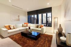DOCKLANDS 51 South Wharf Drive FOR SALE $2,200,000 to $2,500,000 A Fresh Approach, A New View The substantial, family focused spaces of this superb contemporary residence right by the river, so close to the city, set a fabulous new agenda. Three downstairs bedrooms and a fully tiled bathroom complement a sensational top floor main bedroom featuring huge ensuite, sunny balcony and light filed adjacent lounge. In between the accommodation levels, two luxurious first floor living/dining domains, both formal and informal, are accompanied by an open plan kitchen featuring the full suite of Miele appliances including integrated coffee machine. Expansive north facing entertaining decked terrace completes a cutting edge combination of spaces, with heating/cooling, security, double garage and service courtyard offering additional parking. Tomorrow, delivered today.