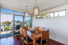 2 Eastview Terrace, Jan Juc VIC Enjoy the Eastview Lifestyle! If you are seeking out a home in Jan Juc it stands to reason that you are drawn to the water, what better way to fulfill that need than with a view of the ocean to wake up to every morning. Situated in one of the quieter pockets of a relaxed coastal village, this property in Eastview Terrace takes full advantage of its position which is in easy walking distance to the beach, golf club and shops ensuring you enjoy the landscape and local lifestyle. Contemporary in design, the double story home makes the most of an easy care block of land by maximising both living and outdoor space. Inside, four generous bedrooms on the ground floor are serviced by both a modern family bathroom and ensuite to the master with all except the fourth bedroom enjoying the benefit of WIRs. Providing direct access to the gardens (complete with large garage, double carport and secure parking for boat/caravan), a large second living area on this level provides flexibility and a perfect retreat for the younger members of the family. The upper level is dedicated to everyday living with a bright, spacious kitchen flowing through the dining and family rooms (beyond the handy powder room) onto a well_positioned balcony that offers sweeping, panoramic views over the ocean. Clever design elements, such as the north facing highlight windows, flood the room with natural light giving further depth to the richness of polished timber floorboards whilst, the morning sun through the expanse of windows opening to the balcony invite lazy breakfasts with a paper and the reminder that you do indeed, live by the beach. The simplicity of good quality, well maintained fixtures and neutral tones makes this a comfortable, functional and laid_back home to live in. It is a welcoming home that offers families an opportunity to live their coastal dream without fuss but with a real emphasis on capturing the desire and making it real!