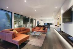 BRIGHTON 1 Laburnum Court AUCTION Saturday 24 May 2014 at 3:00pm An Exhilarating Experience Of Architectural Brilliance A new contemporary masterpiece of absolute luxury designed by architect Martin Friedrich provides a perfect 3 / 4 bedroom residence for any stage of life in a quiet Brighton enclave between the shopping strips of Church and Bay Street and close to all main schools. The design provides the ultimate in indoor-outdoor living with a large spacious living room opening via fully retractable sliding doors to the entertainer's garden designed by Jack Merlo, with built in slim line Electrolux barbecue and glass tiled wrap around pool. The interior of the residence features a magnificent sculptural circular staircase transcending all three levels and also has provision for a lift - structure, power and phone line provided. The chef's kitchen fitted with Pietro Grigio marble, Miele and Liebherr appliances, has superbly detailed cabinetry with walk in butler's pantry. Other areas on the ground floor include a second living room or possible fourth bedroom, home office fitted with built in desk and exquisitely detailed timber cabinets, laundry with built in TV and powder room. On the upper level, three spacious bedrooms enjoy access to ensuite bathrooms, walk-in robes & private balconies. The lower level includes a fully equipped home theatre, gym, wine cellar, storeroom, second powder room and substantial five car basement garage with turntable. Other high end features of this luxurious home include reverse cycle air conditioning, alarm system, intercom, video -monitored entry, double glazed windows, hand selected European Oak flooring, rainwater storage tank, remote controlled blinds with recessed pelmets, ambient gas fire in living room, Niles speakers indoors and out, drip irrigation system, laundry chute from first floor. INSPECT BY APPOINTMENT AT ADVERTISED TIMES.
