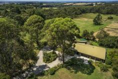 155-159 Bittern-Dromana Road Merricks North VIC 3926 Bombora Vista Perched high upon the rolling fields of the exclusive enclave of Merricks North, this delightful and expansive family home is the perfect Mornington Peninsula retreat. Less than one hour from the city and comprising two titles, this magnificent property enjoys approx 2.6 acres of manicured lawns and gardens and looks across farmland to a captivating view of Westernport Bay and Phillip Island. The three level brick and timber house has featured in style and design magazine, Inside Out, and boasts an upstairs master bedroom complete with walk through robes, an ensuite with claw foot bath that looks out across the garden, and a private deck enjoying the view through the trees. There’s a further three, vast children’s bedrooms, one with ensuite, a family bathroom, large living room with fireplace, and dining area. A bright and sunny kitchen and adjacent breakfast alcove also bask in the extensive views. On the lower level is a big and cosy lounge room, while upstairs, an office/study also has the benefit of the glorious garden outlook and a deck complete with flagpole and weather vane. A paved courtyard at the front enjoys the Mornington Peninsula tranquility while the back of the house is wrapped in a huge deck, maximising the incredible vista. Just minutes from both Balnarring and Red Hill shopping centres, cafes and restaurants, and smack bang in the heart of wine country, this truly glorious property offers a most desirable slice of Mornington Peninsula living.