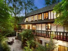 ONE-OF-A-KIND DREAM HOME, EXCLUSIVE SETTING 7 PERRINS CREEK ROAD, OLINDA, VIC 3788 4 2 6 Entertainers paradise Exclusive privacy and tranquillity Lush low-maintenance forest setting Set on approximately 1 acre of low-maintenance garden surrounds with another 9 acres of lush private forest offering pure peace and serenity, this much-loved property with widespread parquetry flooring and cable internet offers flexible living over 3 distinct levels. With its gorgeous Tudor architectural style modelled on the best of Western Europe; Feathertop, a hidden gem of a property nestled amongst giant poplars and lush ferns is the ultimate seclusion weekender, fairytale family home or even possible one-of-a-kind B&B while being only 15 minutes away from the Monash Freeway. On the entry level find an expansive living room (with bay window), separate dining and extensive kitchen (boasting Blanco appliances); powder room and private study with built-in mahogany wall units. Decorative Oregon ceiling beams extend throughout. An amazing spiral wooden staircase ascends to a vast master bedroom with ensuite (double shower). 2 further bedrooms and a huge main bathroom with spa bath and double basins can be found under the characteristically steeply pitched roof. All bedrooms include high quality crafted built-in robes and chests of draws and their own private balconies. Additional storage area in the attic completes the 1st floor. The open plan basement provides the perfect opportunity to escape the summer holiday heat. Set up your own theatre or games room, gym and wine cellar. Also discover on this floor a separate laundry, additional powder room and internal access to a 6 car concrete built garage. Perfect for entertaining, your guests who will love to visit this picturesque setting - entertain amongst the treetops in the paved outdoor areas or on the extensive balcony surrounding the first level. If you have ever wanted a fairy tale life or home to be captivated by, Feathertop will make your dreams come true! FOR SALEExpressions Of Interest FEATURES GENERAL FEATURES Property Type: House Bedrooms: 4 Bathrooms: 2 INDOOR Indoor Spa Built in Wardrobes Dishwasher Air Conditioning OUTDOOR Garage Spaces: 6 OTHER FEATURES Privacy and Tranquillity, Entertaining terraces, Tudor architecture , Parquetry flooring CONTACTS SCOTT BANKS Mobile: 0411 700 099 Email this agent