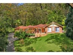 194 Empire Bay Drive, Empire Bay NSW Country feel with a Coastal lifestyle This stunning North-facing home on just under an acre features an easy-care well-maintained garden and enviable privacy and position. The land is gently sloping, which provides an elevated site and tranquil outlook for this superbly maintained home. The owners have kept this property in pristine condition. Purpose built to provide in-law accommodation, the main home offers two bedrooms, one bathroom, a modern kitchen and family rooms. The in-law accommodation features a double bedroom with ensuite, lounge room, a kitchenette/wet bar area, and own entrance. With all this accommodation under one roof, the new owners will have the choice between taking advantage of the vendor's shrewd set-up. Featuring air conditioning, an alarm system, a workshop, a double automatic garage, a large paved entertaining area as well as natural bushland, this home is sure to impress the astute purchaser. Positioned close to beaches, schools, shops, and boating facilities this is a fabulous opportunity to secure a true lifestyle property!