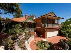 97 Evandale Street, Floreat WA A BIG HOME FOR BIG A FAMILY ALL OFFERS PRESENTED BY MONDAY 7TH JULY (UNLESS SOLD PRIOR) For families in need of space, this impressive home ends the search. Perfectly positioned in a quiet, tree-lined street and overlooking the pristine bushland of Bold Park, this 'modern classic' federation house is the perfect connection point for busy families pursuing an active Western Suburbs lifestyle. This architecturally designed home has been constructed to the highest standards. The quality of traditional craftsmanship is clearly evident; the refined style in which it is presented will not date, and will continue to satisfy for many years to come. This inviting home is well suited for contemporary living, boasting generously proportioned rooms with multiple living areas. Indoors, a large country kitchen creates a comfortable setting for family meal, and informal gatherings, while a formal lounge and dining room, with a built in buffet, is suited for lavish formal entertaining. A jarrah spiral staircase ascends from a middle sitting area to a romantic loft with dormer windows; which would serve as a hobby room, teenagers' haven or an art studio. A further separate, comfortable lounge area that would also be perfect for a theatre or games room is included. Also, a study lined with jarrah bookshelves, with an adjoining sitting room, forms a vital retreat. A walk-in wine store completes the internal picture, of luxury and spaciousness. Outside, a beautiful front garden, featuring contoured limestone walls and a shaded sitting area, create a compelling streetscape; and useable, paved, flat surfaces, extend from the front of the house to the back. If you and your family would enjoy awakening to the sounds of birds singing; would like easy access to the beach, or the tranquil bush trails of Bold Park, or Perth's best schools and other amenities, then you should positively consider making this exceptional house your new address.