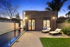 86 Wells Road, Beaumaris VIC Auction 10:30am, Saturday August 9, 2014 $1,295,000 - $1,395,000 3 B 2 b 2 C Watch property video A Statement of Style, Space & Design Get ready to impress with this up to 4 bedroom, 2.5 bathroom spectacular statement of architectural style boasting an exceptional sense of space & an innovative central entertainment zone designed to bring the outdoors in. Superbly positioned only two doors to Illaroo Reserve & pre-school, and a short stroll to the beach, Seaview shops & cafes, schools and the bus. Beyond a striking copper façade & oversized pivoting door, warm Jarrah & polished concrete floors, expanses of glass & soaring voids define a beautifully balanced layout flooded in northerly light. Vast living zones are connected to multiple outdoor entertaining areas including a sun drenched central courtyard with glass cafe-style sliders (pizza oven & pond), a private front courtyard with boxed Merbau seating & a shimmering black tiled pool set in rear landscaped gardens. A luxurious Caesarstone & stainless steel appliance kitchen with island bench, butlers' pantry, dual dishwashers & a built in Miele coffee machine is at the heart of inviting family (gas OFP), living & dining areas. A ground floor study & powder room could double as guest quarters; and complements spacious upstairs bedrooms, 2 with a dual access bathroom & built in robes, and master with his & hers walk in robes and dual vanity, double shower en suite. Impeccably appointed with all the extras including 3 metre ceilings upstairs & down, extensive storage, ducted heating, evaporative air conditioning, indoor/outdoor surround sound, intercom, security alarm, plantation shutters, Shugg windows, automatic blinds (for void), laundry chute, garden lighting, irrigation, gas pool heating and a direct home access auto double garage. For more information about this statement entertainer please contact Andrew Campbell at Buxton Brighton on 0419 366 545 http://www.86.wellsroadbeaumaris.com/