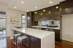 2/16 Birkalla Terrace Plympton SA 5038
Million-dollar looks and courtyard convenience minus the trendy-suburb
price tag; find all this and more in peaceful Plympton, minutes to
Glenelg beaches and Jetty Road attractions.
Designed and built by HIA award-winners, and tucked privately at the
rear of an exclusive community of three, this stunning 3-bedroom,
2-bathroom home sets the benchmark for contemporary style and low
maintenance liveability. Enjoy quality at its finest with 3-metre
ceilings, 2.4-metre Cedar doors, solid Jarrah floors, Caesar Stone bench
tops and stunning 2-pac cabinetry that will take a lifetime to fill.
There's even a separate laundry packed full of floor-to-ceiling storage!
Relax and entertain with 195m² of space, where stunning living areas wow
with open-plan ease, flowing out to fully-paved alfresco recreation
under the main roof. Enjoying the outdoors and fresh air has never been
more tempting!
Combining practicality and chic appeal, the kitchen is every
entertainer's dream. With its waterfall ends, the lovely long island
bench is a magnet for family and friends while quality stainless steel
appliances will bring out the chef in you, never missing a moment with
the mirrored splash.
Beautiful big bedrooms and indulgent fully-tiled bathrooms featuring
sumptuous Spanish basins and under-bench lighting, offer personal
sanctuaries for you and your guests including a lust-have master suite
with a walk-thru robe and pampering couple's ensuite.
And it's all brand new and only a short walk to buses, K-Mart and the local shopping centre!
Other Features:
Security alarm
Video intercom
Ducted r/c air conditioning
Premium built-in storage throughout
Auto single garage with internal entry