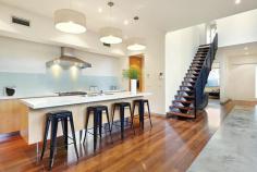 86 Wells Road, Beaumaris VIC Auction 10:30am, Saturday August 9, 2014 $1,295,000 - $1,395,000 3 B 2 b 2 C Watch property video A Statement of Style, Space & Design Get ready to impress with this up to 4 bedroom, 2.5 bathroom spectacular statement of architectural style boasting an exceptional sense of space & an innovative central entertainment zone designed to bring the outdoors in. Superbly positioned only two doors to Illaroo Reserve & pre-school, and a short stroll to the beach, Seaview shops & cafes, schools and the bus. Beyond a striking copper façade & oversized pivoting door, warm Jarrah & polished concrete floors, expanses of glass & soaring voids define a beautifully balanced layout flooded in northerly light. Vast living zones are connected to multiple outdoor entertaining areas including a sun drenched central courtyard with glass cafe-style sliders (pizza oven & pond), a private front courtyard with boxed Merbau seating & a shimmering black tiled pool set in rear landscaped gardens. A luxurious Caesarstone & stainless steel appliance kitchen with island bench, butlers' pantry, dual dishwashers & a built in Miele coffee machine is at the heart of inviting family (gas OFP), living & dining areas. A ground floor study & powder room could double as guest quarters; and complements spacious upstairs bedrooms, 2 with a dual access bathroom & built in robes, and master with his & hers walk in robes and dual vanity, double shower en suite. Impeccably appointed with all the extras including 3 metre ceilings upstairs & down, extensive storage, ducted heating, evaporative air conditioning, indoor/outdoor surround sound, intercom, security alarm, plantation shutters, Shugg windows, automatic blinds (for void), laundry chute, garden lighting, irrigation, gas pool heating and a direct home access auto double garage. For more information about this statement entertainer please contact Andrew Campbell at Buxton Brighton on 0419 366 545 http://www.86.wellsroadbeaumaris.com/