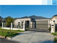 21 Ferris Street Magill SA 5072 This well designed freestanding home is sure to impress! It boasts luxurious finishes with all the extras. You will love the spacious room sizes. This is the one. Set behind beautiful front fencing with electric gates, this fantastic looking home has a great street appeal in a highly sought after location. Enjoying a lovely outlook over the front garden setting, is the generous main bedroom suite, complete with a stylish ensuite bathroom finished with designer tap ware and floor to ceiling tiles. Even the spacious walk in robe includes draws and shelving. Bedrooms 2 and 3 are oversized and are accessed via a private wing. They both include built in robes and adjacent is a wall of extra storage cupboards and the classy second bathroom. What an impressive open plan living space! Large enough for a huge dining table and a comfortable area for everyday living and entertaining. The kitchen is a stand out feature with mixed neutral colour tones a huge stone breakfast bar and quality appliances. Flowing seamlessly from inside to out, buyers will be impressed with the outdoor alfresco area that overlooks the low maintenance lawn and garden areas.