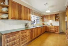 4 Avenue Athol Canterbury VIC 3126 With outstanding garden vistas from many rooms, the light filled and generous interior accommodation comprises porch to entry foyer, formal living and dining rooms, well equipped blackwood timber kitchen and meals area, family room (with northern aspect), two formal study rooms, laundry and direct internal access from the double lockup garage. Downstairs also includes a spacious principal bedroom (BIR's & ensuite), second bedroom (BIR's & ensuite); the gracious stairway leads to the large third, fourth and fifth bedrooms (all with BIR's) plus a third bathroom. Additional features include: ducted heating and cooling, delightful paved alfresco entertaining area set within generous landscaped garden surrounds and powered driveway entry gates.