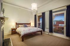 241 Victoria Street BRUNSWICK VIC 3056 An outstanding family-focused opportunity featuring secure north-facing rear and dual street frontage, 'Moulang' c1890 is a superbly renovated balcony terrace in a friendly neighbourhood near vibrant Sydney Road, Lygon Street and Princes Hill schools. A fabulous family haven with gorgeous filigreed facade and generous four-bedroom floorplan; heritage character and modern quality extend throughout this spacious Victorian residence culminating in a huge open-plan family zone overlooking secluded alfresco entertaining area and remote-control double garage (to Harris Street). Includes arched hallway, formal sitting room, living/dining area, fully-appointed stone kitchen, large family bathroom, separate laundry, heating/cooling, high classical ceilings, polished floorboards, open fireplaces, abundant storage, NBN connected and views towards the city.