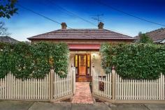 39 North Street Ascot Vale VIC 3032 In a leafy plantation street, this meticulously renovated three bedroom Victorian home with studio office, successfully blends period charm with modern day comfort. The open plan living space comprises a contemporary two-tone kitchen with stainless steel appliances, stone bench tops and family meals around the island bar, beside a formal dining space and adjoining elegant lounge. Accommodation is plentiful with three large double bedrooms fitted with generous robes, each with open fire place. The substantial main bathroom flaunts luxury, a large covered deck overlooking landscaped gardens allows for effortless entertaining, whilst the rear ROW leads into the double garage. Complete with polished floors, soaring ornate ceilings, pretty leadlight, alarm, heating, cooling, with tram, shops, restaurants and schools at your door, it's the perfect family package.