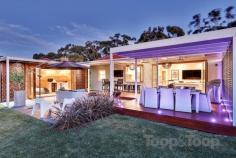 27 Hamilton Ave Warradale SA 5046 This amazing residence is perfectly positioned adjacent the tree-lined Hamilton reserve and offers a tranquil setting for you to just move straight in and start enjoying your new carefree lifestyle in this impeccably renovated home. This 1950's stoned fronted home has been completely transformed into a once in a lifetime five star abode that's sure to provide its fortunate owners pride of ownership for many happy years to come. Having had no expense spared with $400,000 spent on renovations and boasting a showcase of total craftsmanship and quality with nothing but the best fittings, fixtures and top of the range appliances and accessories used throughout. Offering a free flowing open plan design that begins with calming water featured formal entrance through to spacious living that opens out onto a sensational entertaining deck, seamlessly extending the living areas of the home and providing the perfect setting for those who love to entertain and enjoy outdoor living. The living area boasts polished floorboards, a heart-warming gas fireplace with stylish stacked stone surround and floor to ceiling tri-fold timber framed glass doors allowing loads of natural light and a true sense of space. The sleek masterchefs kitchen will assist you in your culinary adventures with quality top of the range appliances including stainless steel 900 wide gas cook-top and oven, dishwasher, glass splash-backs, stone bench tops, with ample bench and cupboard space on hand. The large island bench provides further preparation space and an informal meals area/breakfast bar and is sure to be the gathering place at many a dinner party and a handy servery/bar opens the kitchen out to the alfresco area, easily ensuring connection with guests and family The enormous decked and paved alfresco area takes full advantage of the North rear aspect and offers a private oasis to enjoy the beautiful gardens, lush lawn and brilliant entertaining area. Overhead heating strips provide comfort in the cooler months and feature walls and vertical gardens are a further feast for the senses. A detached studio/retreat with bar overlooks and opens out onto the alfresco area via bi-fold timber and glass doors and provides a further living room, home theatre room or bedroom if required complete with large walk-in robe and a brilliant timber feature wall. The master suite boasts the warmth of a modern Aussie oak built in bed head and views over the adjacent parkland, of course you'll enjoy the luxury of a large walk-in robe and en-suite bathroom fitted with floor to ceiling glass tiling and a deep stand alone bath tub for long soaks plus dual shower and dual vanities. The second bedroom is of good proportions and also offers views over the parkland and the convenience of a built-in robe. This bedroom is serviced by the sleekly finished main bathroom. The third bedroom has polished timber floors, large walk-in robe and would make an ideal room for a teenager or older family member if required. There's the added bonus of a study nook area and loads of storage. The landscaped gardens are well established and provide low maintenance lifestyle living. There's secure remote access off street parking for two cars plus room for more vehicles or a boat or caravan on the forecourt area. You'll be perfectly positioned adjacent spacious tree lined parkland complete with playground and tennis courts! Great local beaches are only minutes away, as is schooling, shopping options at Marion or Jetty Road Glenelg and easy access transport to the CBD or Flinders Medical/University It's easy to see why this house was the winning home on a national television series.