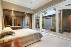 3 St Kinnord Street Aberfeldie VIC 3040 mpeccably planned and built to the highest of standards, this spectacular four bedroom plus study executive abode showcases inspiration from the elegant Victorian era, united with cutting-edge technology, extraordinary proportions, superb materials and astonishing entertaining credentials. Situated in a highly desirable locale, its assured style and unswerving dedication to quality will impress. From a generous study and vast formal lounge and dining with marble fireplace, the home flows through a wide hall, past an elegant side courtyard, laundry and powder room, to the central family, meals and splendid Miele and marble-filled kitchen. Highlights here include abundant Calacatta marble, three ovens (a 900mm electric, convection and steamer oven), plus wok burners, an electric cooktop, integrated dishwasher and Qasair range hood. There's also a spacious games room, plus a paved entertaining area and self-cleaning, heated, fully tiled swimming pool, so you'll have everything you dreamed of. Bedrooms all have built-in robes and exterior access, and three stunning marble-tiled bathrooms include two ensuites. Additionally, you'll find a second powder room, C-Bus automation, an alarm, hydronic heating, refrigerated cooling, a storage attic, front electronic garage, and rear right-of-way. Transport, shops, schools and Aberfeldie Park are within a stroll, so you'll certainly be positioned to succeed! Features -Architect-designed, and landscaped by Paul Bangay -Victorian era features and superior modern technology -Glorious high ceilings, vast rooms and magnificent marble -Alarm, C-BUS home automation and surround sound -Hydronic heating, refrigerated cooling, remote garage -Enormous outdoor entertaining area & fully tiled pool