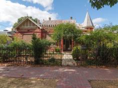 67 Third Ave St Peters SA 5069 Property Information Character
Return Veranda Queen Anne Villa on over 1000 square meters. This
property offers much scope for a modern update and the ability to put
your own personal touch to this rare gem. Held by the same owner for 55
years and still in the original condition it was then purchased in, this
substantial family home will sure to delight another family for years
to come Features Include:
Pressed metal spire Sandstone turret over the front entrance Tessellated tiles adorn the front porch as does the original fretwork. Leadlight windows will enchant as you enter this exceptional opportunity Large dining room and formal lounge with beautiful pressed metal ceilings Working open fireplaces and gorgeous leadlight windows all accessed by the wide entrance hall Intricate blackwood fretwork Large hardwood skirtings and detailed cornicing. Jarrah floorboards through out The existing extension consists of a toilet, laundry, pantry, 2 kitchens and a cellar
The rear garden is as expected on a block this size, an
abundance of room for the perfect extension. Valuable rear lane access
and a double length garage borders the laneway at the back of the
property. There is also a small shed and covered bird aviary/storage
area. A well established grape vine and fruit trees adorn the garden as
well as a large vegetable garden. This property while in need
of some TLC will respond well to being fully utilized by a family and is
within walking distance to the Adelaide East Primary School and is in
close proximity to some of Adelaide's most prestigious private schools.
The boutique shopping and dining of North Adelaide , Norwood and the
speciality shopping on Walkerville Terrace, Walkerville are only a few
minutes away.
To find out more about 67 Third Avenue, including
expected capital growth, rental returns and pricing, please enter your
details below with your enquiry. A property investment team member will
then contact you by the next business day - we guarantee it!
Want to keep up to date with new investment properties as they come available? Be the first to know through our monthly property alerts , emailed straight to you!