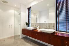 86 Wells Road, Beaumaris VIC Auction 10:30am, Saturday August 9, 2014 $1,295,000 - $1,395,000 3 B 2 b 2 C Watch property video A Statement of Style, Space & Design Get ready to impress with this up to 4 bedroom, 2.5 bathroom spectacular statement of architectural style boasting an exceptional sense of space & an innovative central entertainment zone designed to bring the outdoors in. Superbly positioned only two doors to Illaroo Reserve & pre-school, and a short stroll to the beach, Seaview shops & cafes, schools and the bus. Beyond a striking copper façade & oversized pivoting door, warm Jarrah & polished concrete floors, expanses of glass & soaring voids define a beautifully balanced layout flooded in northerly light. Vast living zones are connected to multiple outdoor entertaining areas including a sun drenched central courtyard with glass cafe-style sliders (pizza oven & pond), a private front courtyard with boxed Merbau seating & a shimmering black tiled pool set in rear landscaped gardens. A luxurious Caesarstone & stainless steel appliance kitchen with island bench, butlers' pantry, dual dishwashers & a built in Miele coffee machine is at the heart of inviting family (gas OFP), living & dining areas. A ground floor study & powder room could double as guest quarters; and complements spacious upstairs bedrooms, 2 with a dual access bathroom & built in robes, and master with his & hers walk in robes and dual vanity, double shower en suite. Impeccably appointed with all the extras including 3 metre ceilings upstairs & down, extensive storage, ducted heating, evaporative air conditioning, indoor/outdoor surround sound, intercom, security alarm, plantation shutters, Shugg windows, automatic blinds (for void), laundry chute, garden lighting, irrigation, gas pool heating and a direct home access auto double garage. For more information about this statement entertainer please contact Andrew Campbell at Buxton Brighton on 0419 366 545 http://www.86.wellsroadbeaumaris.com/