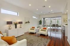 2/16 Birkalla Terrace Plympton SA 5038 Million-dollar looks and courtyard convenience minus the trendy-suburb price tag; find all this and more in peaceful Plympton, minutes to Glenelg beaches and Jetty Road attractions. Designed and built by HIA award-winners, and tucked privately at the rear of an exclusive community of three, this stunning 3-bedroom, 2-bathroom home sets the benchmark for contemporary style and low maintenance liveability. Enjoy quality at its finest with 3-metre ceilings, 2.4-metre Cedar doors, solid Jarrah floors, Caesar Stone bench tops and stunning 2-pac cabinetry that will take a lifetime to fill. There's even a separate laundry packed full of floor-to-ceiling storage! Relax and entertain with 195m² of space, where stunning living areas wow with open-plan ease, flowing out to fully-paved alfresco recreation under the main roof. Enjoying the outdoors and fresh air has never been more tempting! Combining practicality and chic appeal, the kitchen is every entertainer's dream. With its waterfall ends, the lovely long island bench is a magnet for family and friends while quality stainless steel appliances will bring out the chef in you, never missing a moment with the mirrored splash. Beautiful big bedrooms and indulgent fully-tiled bathrooms featuring sumptuous Spanish basins and under-bench lighting, offer personal sanctuaries for you and your guests including a lust-have master suite with a walk-thru robe and pampering couple's ensuite. And it's all brand new and only a short walk to buses, K-Mart and the local shopping centre! Other Features: Security alarm Video intercom Ducted r/c air conditioning Premium built-in storage throughout Auto single garage with internal entry