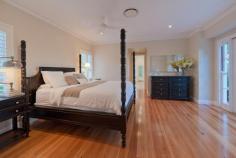 UPPER BROOKFIELD 654 Upper Brookfield Road Bed: 4 | Bath: 3 | Car: 3 | Tennis Court: 1 | Pool: 1 Grand Residence - Private Estate A sanctuary of privacy and nature on a mountain ridge at the southern end of the D’agular range, this magnificent family home lays claim to 10 acres of serene bush land in one of Brisbane’s finest boutique “rural - residential” estates. Incredibly, the home itself is positioned on a flat, landscaped area of over one acre on the top of the mountain, facing North East. This mountain top location affords breathtaking, panoramic views over Brisbane, the north and south ranges and beyond to the islands of Moreton Bay. A true sense of arrival is experienced upon approaching the home via automated iron gates and a 250m long driveway, flanked by stonewalls and gardens. A cobblestone circular drive is bordered by manicured gardens and features a beautiful central lily pond . The home reflects grandeur and elegance inspired by classical European style architecture. It offers absolute privacy, completely uninhibited by neighbours and the hustle and bustle of suburbia. Completed in 2007, the home is constructed of limestone blocks sourced from Mt Gambier, South Australia. Once inside, an impressive entry hall divides spacious his and hers studies. The hall guides guests to the focal point of the home; the “Grand Room”. Open plan in design, the light-filled Grand Room features soaring 14 foot ceilings, oversized windows and French doors and an attractive open wood burning fireplace . It comprises of the formal lounge, dining and kitchen. The kitchen is enormous and classical in its design. It features provincial style timber cabinetry, traditional butlers sink and stone bench tops. A striking iron chandelier hangs above the large island bench. It showcases a comprehensive range of appliances including Ilve oven and gas cook top, integrated coffee machine, 4 dishwasher drawers, microwave and stainless steel double door fridge. Adjoining the kitchen is the media room, which includes surround sound and rear projector systems. The grand room opens via sliding French doors to an expansive covered entertaining terrace. It enjoys a perfect north east aspect and the most spectacular views of the grounds and beyond. The terrace offers direct access to the sparkling swimming pool. Approximately 16m x 4m, the pool area features Chelmstone paving. The resort style facilities continue with the property also boasting a championship north south tennis court with permaflex synthetic grass and lighting for night games. Ideal for entertaining, a gorgeous gazebo is located adjacent to the court. The main house has four bedrooms; each is generous in size and offers beautiful views of the surrounding bush land. Two of the family bedrooms share a cleverly designed two-way ensuite with separate vanities. The master bedroom is located in a private wing and enjoys a north aspect with views to the mountains. It includes his and her walk in robes and an elegant ensuite with a classic freestanding bath, private shower recess and twin vanities with stone bench tops. A fourth bedroom is reserved as a guest room and is serviced by the family bathroom. There are also two outdoor showers. A laundry and mudroom complete the internal facilities. A large, 80m2 enclosed garage provides housing for 3 vehicles and abundant storage options. One of the most versatile features of the property is the fully self-contained 2 story guest house. Constructed in 2001, it comprises 2 bedrooms and nursery (or large study) and a bathroom. The ground level offers a kitchen and a spacious open plan living and dining area which is currently used as a home gym and recreation room. There is also a large laundry/craft room and large workshop and storage area at the rear and covered parking for 2 more vehicles. The property is part of a gated rural residential estate, which offers a range of unique and exclusive facilities. These include common parklands with dam and two standard size golf greens. There is also a shared 40-acre equestrian reserve with a fully funded equestrian development plan for stables, arena and paddocks. In addition to the hiking and riding opportunities within the estate, the property backs on to thousands of acres of hiking and riding trails through the D’agular Range, Lake Manchester, Mt. Crosby and Mt. Glorious. Seldom does a unique and stunning residence claiming such significant land size, spectacular views and exclusive facilities become available in a private bush land setting this close to the CBD. This is a rare opportunity to secure a property of distinction, unparalleled privacy and an exclusive lifestyle. Features 4 Hectares (10 Acres) 1 Acre of Level, Landscaped Residential Area Elevated, North-East Aspect Panoramic Views over Brisbane, North & South Ranges & Moreton Bay Pool (approx. 16m x 4m) Championship, Floodlit North-South Tennis Court Gazebo Automatic Security Entry Gates Cobblestone Circular Drive 200,000L Drinking Water Tank (automatic pressure pump) 25,000L Irrigation Water Tank Automatic Irrigation System Established Herb & Veggie Gardens Orchard Area (currently unplanted) Chicken Coop Area