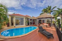 6 Crestmore Court Mermaid Waters Qld 4218 TRANQUIL WIDE WATER VISTA, QUIET AND SERENE POSITION Look
no further, this quality built home is located in the prestige
'Paradise Quays' area of Mermaid Waters and is ready to be SOLD!
Motivated sellers are priced to sell their lovely waterfront lifestyle
home. This contemporary light filled home showcases 9 foot high
ceilings, glass windows and sliding doors that cover the entire length
of the home taking in the sweeping water views. With its relaxed resort
style feel you will enjoy the benefits of various options to entertain
from your indoor enclosed sunroom to the outdoor thatched pavilion
overlooking the sparking in ground pool. Zoned ducted air
conditioning features throughout the living spaces and good size
bedrooms, the master bedroom has a generous walk in robe, modern ensuite
and inviting oval spa. The property sits on a large 821m2 block, has 21
metres of deep water frontage for any size boat, ocean access and solid
concrete revetment wall around the bay. This character filled home should certainly be on your list to inspect! Features: • 3 good size bedrooms plus Office or 4th bedroom • 2 bathrooms + powder room • 3 Car lock up garage • Lounge room, dining room and living off kitchen • Water view Kitchen, 2 pac cabinets, granite worktops & s.s appliances • Ducted air-conditioning • Impressive Atrium foyer • Entertaining hardwood timber deck • Solar System • Low maintenance gardens AUCTION ON SITE SATURDAY 9TH AUGUST, 2014 AT 11.00 AM