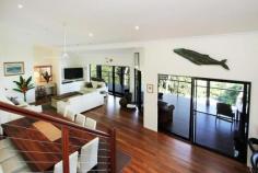 HAMILTON ISLAND, Lot LRF, 2 Cycad Close Long term residents of Hamilton Island Bronwyn & Percy have decided to place their large family home on the market. Situated in the quiet cul-de-sac of Cycad Close and amongst established private homes, it's very central to both the resort and marina precinct. This lovely property was cleverly designed by the owners and Chris Beckingham to blend with the natural slope of the block and surrounding foliage. Purpose built for a large family the home has an expansive open plan living and dining area, all feeding off a huge kitchen. Sliding glass doors bring the outside in, with a massive undercover balcony area that captures your views over the ocean, marina and beyond. The added extra of an oversized servery window into the kitchen seals this home as a wonderful entertainer's property. The master en-suite bedroom and two other bedrooms are elevated above the living area with their own special water views. Wandering downstairs uncovers a large self contained apartment with kitchen, laundry, dining, lounge and en-suite bedroom perfect for guests or family members to make themselves at home. This private zone leads you to the wonderful pool and entertaining deck area where you can relax and take in the views. At the rear of the house is a garage and massive storage area where the owners use part of this space as an office. This area could be made into a games room, gym or work space for the home handyman with plenty of tools As well as being the owners private residence the property is on the holiday rental market generating a steady little stream of income for the owners, who stay on their boat when lucky guests are occupying the home. Please feel free to contact our sales team to coordinate an inspection of this lovely family home.
