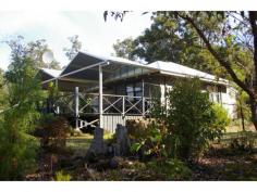 27 Hovea Place Nannup WA 6275 There are some things that are timeless on a property and the superb river view is one such thing. Imagine sitting out on your veranda having drinks with friends overlooking the river that is there all year round. Two bedroomed Jarrah weatherboard cottage with new roof and a massive covered deck area to make the best of the outdoor lifestyle. The block is flat and has a good sized area cleared for fire safety and further building. Powered 11×9 colourbond shed and large rainwater tank. Phone is connected with ADSL available. Jalbarragup is the river and bush area 25 km south of Nannup. There is a strong sense of community amongst the owners here. With the final sealing of Mowen Road, Nannup is only a 35 minute drive from the Margaret River region and 60 km from Busselton where the regional airport is situated.