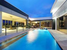 2 Kensington Mews Sovereign Islands Qld 4216 Breathtaking design and construction unite - Stunning
* Double allotment, 3-4.5 ceilings throughout, timber and stone
* 5 Grand bedrooms, guest suite, children's wing
* Concealed home cinema - first class entertainment
* Marble and Stainless steel details to gourmet kitchen
* Butlers pantry/scullery - an entertainers delight
* Built in BBQ Lanai, seamless indoor & outdoor flow with bi-folds
* Courtyard swimming pool offers superior privacy
* Travertine, Chandeliers, 4 plus car garage, room for a caravan