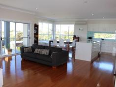 1 Torquay Circuit Hallidays Point NSW 2430 Set on a large 836 square metre corner block with magnificent ocean views to the north and east. Split level home with high ceilings throughout, side access to backyard, tiled balcony with sea views and stairs to the backyard. Open plan living, kitchen and dining with timber floors, separate formal loungeroom, third living/theatre room downstairs. Spacious kitchen with stone benchtops and European appliances. Master bedroom features walk in robe and ensuite, built-ins in all bedrooms. Air conditioning, solar power and ceiling fans. Situated in an award winning development, minutes walk to the beach and access to parkland and cycle ways. Only 3 hours north of Sydney on the Mid North Coast centrally located between two large regional centres of Forster/Tuncurry and Taree.