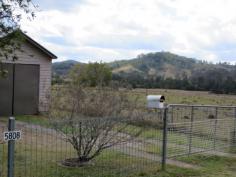 5808 Bruxner Hwy, Mummulgum This lovely home has amazing views of rolling hills and lush green countryside
* Perfect for the motor homer or semi retiree with village style living
with general store across the road and a great little community hall
with many activities, primary school across the road
* Positioned in a private position with a back verandah facing the view
* Owner has done renovations in the last couple of years, with new
bathroom, large loungeroom area, modern kitchen,seperate dining and 2
bedrooms plus sunroom
* Heaps of cupboard space,outside toilet,, solar panels with buyback power scheme, garage and garden shed
* 5.5 thousand gallon tanks, large block with fruit trees and established gardens
* A great Buy !