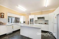 28 Greenwood Rd Kellyville NSW 2155 Set on a sensational 733sqm garden block in the heart of the highly sought Village precinct, this immaculate and freshly updated older-style home is simply brimming with family appeal. With local schools, parklands and city express bus all within easy walking distance, the property offers well-proportioned interiors including defined lounge and dining areas, large kitchen with gas cook-top, well maintained bathroom and ensuite, over-sized laundry and four generous bedrooms with built-ins. There are internal points for gas heating, along with 2 x split system air-conditioners and ceiling fans to several key living areas. Expansive and level with plenty of child and pet friendly lawn, the deep rear garden even comes complete with its own cubby-house, while the tandem garage has drive-through access and 3-phase power. Ready to move in and enjoy as is, yet with scope to further contemporize if desired; your new family home awaits.